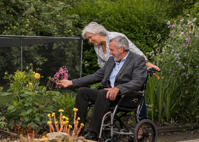 Resident and loved one spending time in the garden